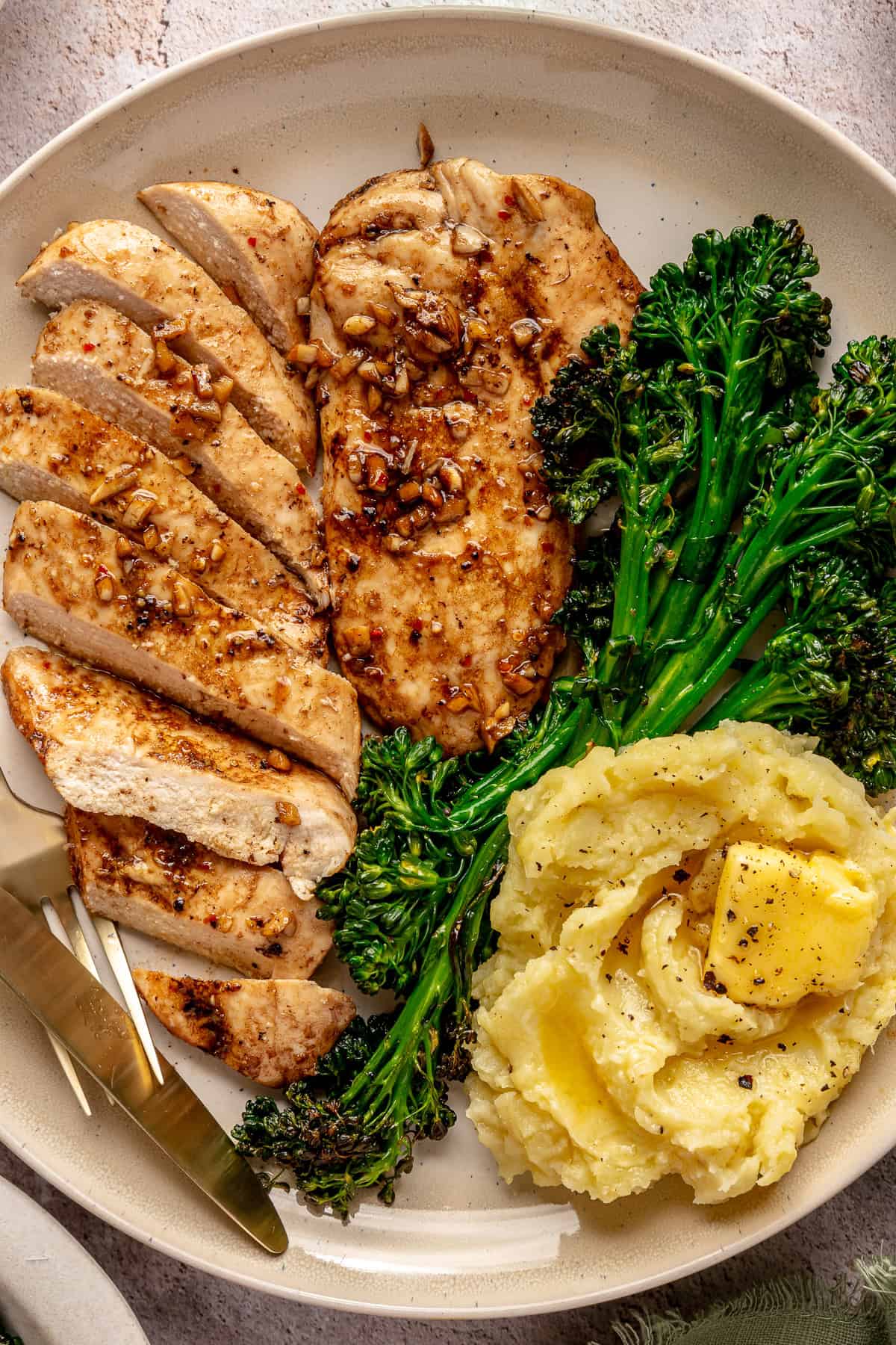 Main -  Thyme and Garlic Chicken on Creamy Mash Potato, Broccolini with Sweet Onion, Pea and Bacon Jus (gf)