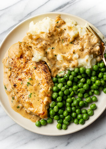 Main: Roasted Chicken Breast with Mash Potatoes, Roasted Carrots, Peas and a Garlic Cream Sauce (gf)