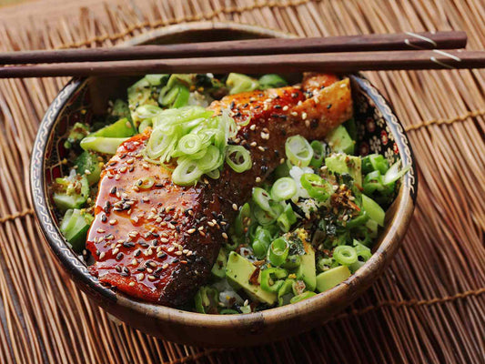 Salad: Teriyaki Salmon with Sushi rice, Cucumber, edamame and shredded carrots, sesame seeds and spring onions